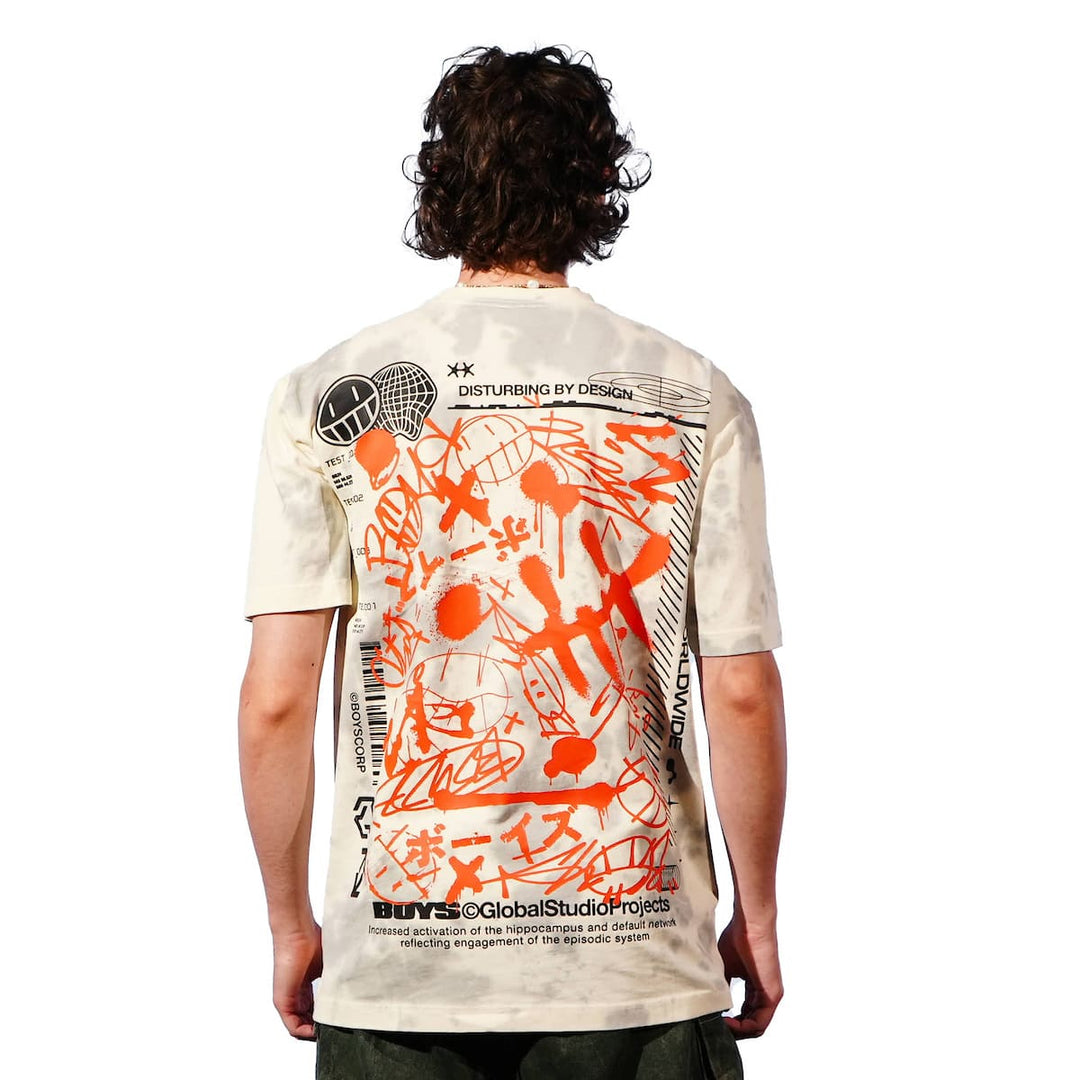 Person wearing a white t-shirt with orange and black graphics on the back, on a white background.